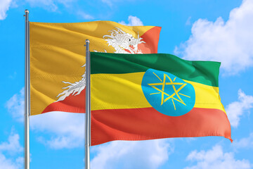 Ethiopia and Bhutan national flag waving in the windy deep blue sky. Diplomacy and international relations concept.