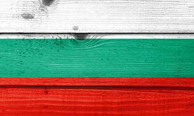 Bulgaria flag painted on old wood plank background. Brushed natural light knotted wooden board...