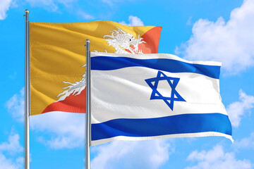 Israel and Bhutan national flag waving in the windy deep blue sky. Diplomacy and international relations concept.