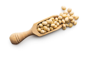 Dried soy beans in wooden scoop isolated on white background.