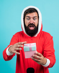 santa claus bearded man hold box wish happy new year and merry christmas holiday ready to celebrate...