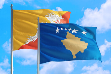 Kosovo and Bhutan national flag waving in the windy deep blue sky. Diplomacy and international relations concept.