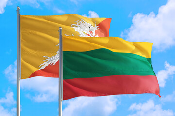 Lithuania and Bhutan national flag waving in the windy deep blue sky. Diplomacy and international relations concept.