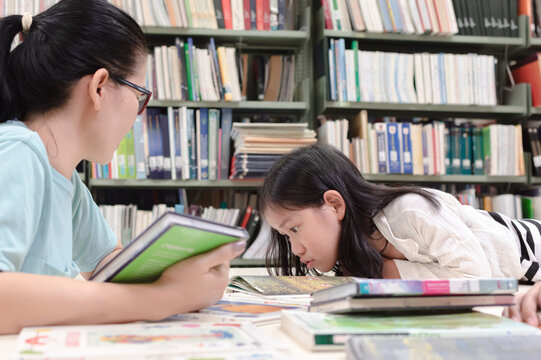 Mother and daughter in public library