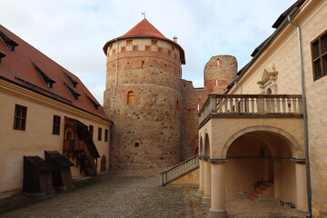 Fototapeta na wymiar The courtyard of the old Bauska castle in Latvia on a sunny autumn day 2020