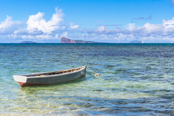 Fototapeta na wymiar Cap Malheureux,view with turquoise sea and traditional boat,Mauritius island