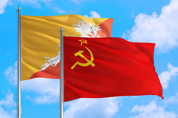 Soviet Union and Bhutan national flag waving in the windy deep blue sky. Diplomacy and international relations concept.