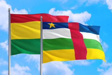 Central African Republic and Bolivia national flag waving in the windy deep blue sky. Diplomacy and international relations concept.