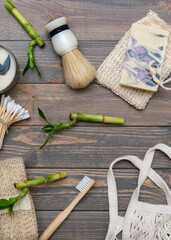 Zero waste bathroom accessories on wooden background. Natural eco bamboo product. Plastic free beauty essentials.