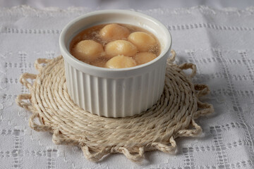 Sweet cheese ball in syrup. (Doce de bola de queijo em calda ou doce de queijo em calda) Sweet typical of Brazilian cuisine