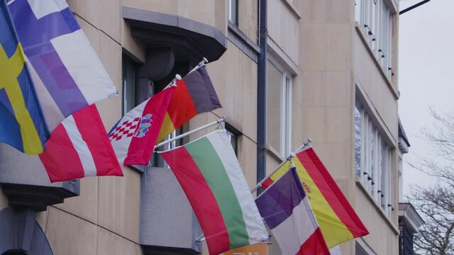 EU states flags blowing in the wind outside the EU parliament