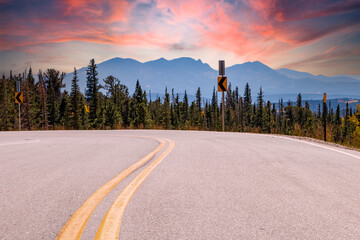 Open highway winding through a colorful Colorado mountain landscape