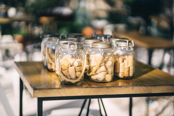 Vintage jars with corks from wine inside