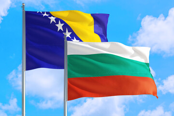 Bulgaria and Bosnia Herzegovina national flag waving in the windy deep blue sky. Diplomacy and international relations concept.