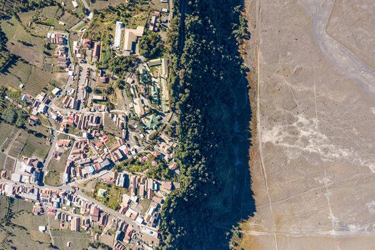Aerial view of Bromo caldera and village, Java, Indonesia.
