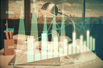 Obraz na płótnie Canvas Double exposure of stock market graph drawing and office interior background. Concept of financial analysis.