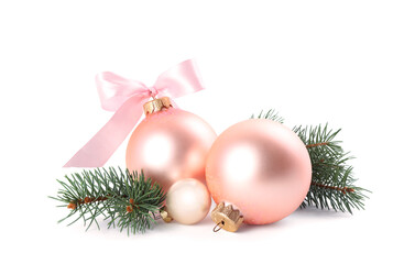 Beautiful Christmas balls and fir branch on white background