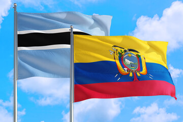 Ecuador and Botswana national flag waving in the windy deep blue sky. Diplomacy and international relations concept.