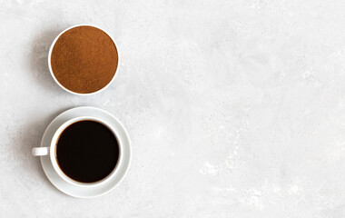 Chicory coffee drink and chicory powder on white background. A small cup of coffee. Decaf. Copy space, view from above.