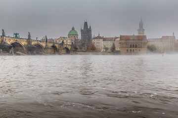 Fog over the Vltava river near Charles Bridge