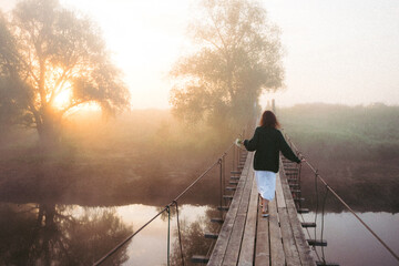 person walking on bridge