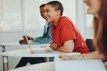 Smiling girl in university classroom