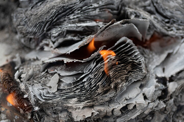 Burning paper stack with tongues of fire with beautiful edges