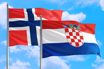 Croatia and Bouvet Islands national flag waving in the windy deep blue sky. Diplomacy and...