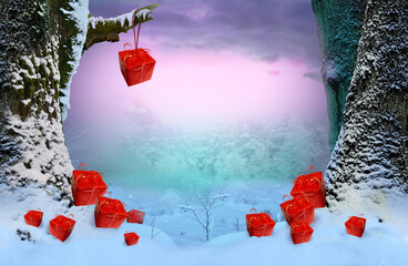 Red gift boxes for New Year on the snow and hanging on the branch. Fairy tale winter landscape with snowy trees and hazy forest in frost