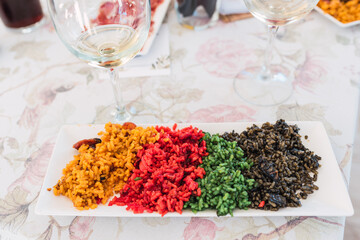Detail of different types of special Valencian paellas, a typical rice dish.