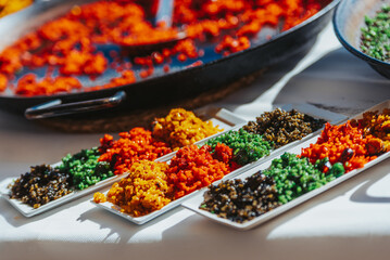Detail of different types of special Valencian paellas, a typical rice dish.