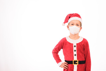 Fototapeta na wymiar Blond child dressed as Santa Claus and sanitary mask isolated on white background and copy space.