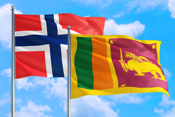 Sri Lanka and Bouvet Islands national flag waving in the windy deep blue sky. Diplomacy and international relations concept.