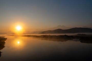 Sunrise with the mist over the river and the plain in Kayseri, in front of Erciyes mountain