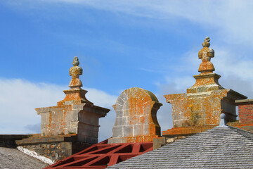 Fototapeta na wymiar Stone decorative tops of a roof