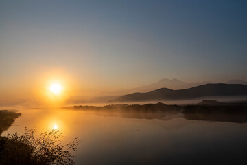 Naklejka premium Sunrise with the mist over the river and the plain in Kayseri, in front of Erciyes mountain
