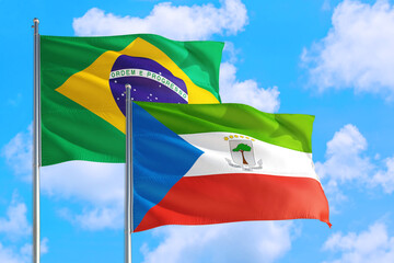 Eritrea and Brazil national flag waving in the windy deep blue sky. Diplomacy and international relations concept.