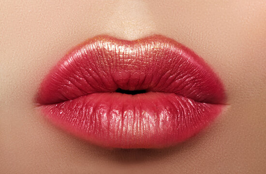 Beautiful Woman Lips with Fashion Lipstick Makeup. Cosmetic, Fashion Make-Up Concept. Beauty Lip Visage. Passionate kiss
