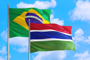 Georgia and Brazil national flag waving in the windy deep blue sky. Diplomacy and international relations concept.