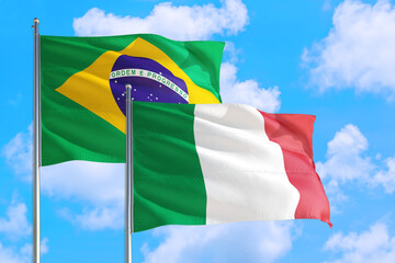 Jamaica and Brazil national flag waving in the windy deep blue sky. Diplomacy and international relations concept.