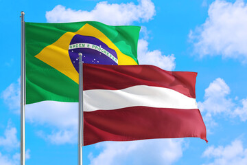 Lebanon and Brazil national flag waving in the windy deep blue sky. Diplomacy and international relations concept.