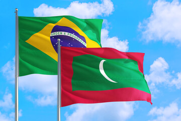 Mali and Brazil national flag waving in the windy deep blue sky. Diplomacy and international relations concept.