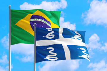 Mauritania and Brazil national flag waving in the windy deep blue sky. Diplomacy and international...