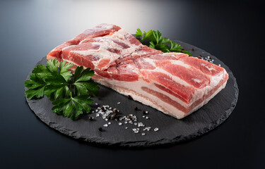 Pork belly on a black stone tray
