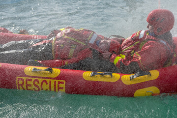 San Rafael, Argentina, november 6, 2020: firefighters in water rescue drill, using canoe and...