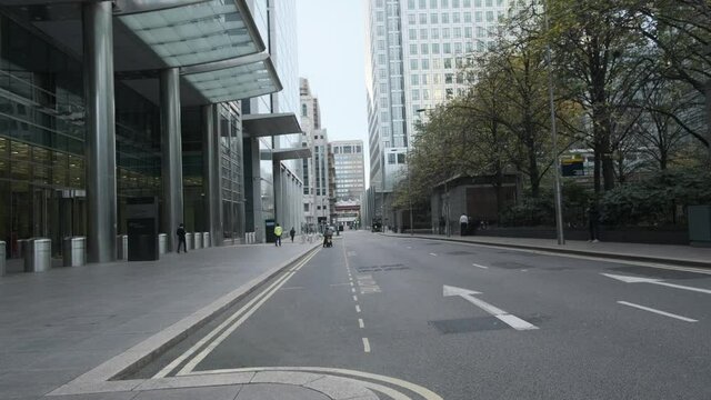 Quiet empty road in Canary Wharf London lockdown restrictions covid 19