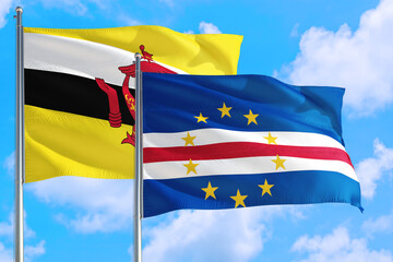 Cape Verde and Brunei national flag waving in the windy deep blue sky. Diplomacy and international relations concept.