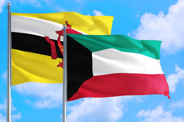 Kuwait and Brunei national flag waving in the windy deep blue sky. Diplomacy and international relations concept.