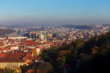 Fototapeta premium Autumn Prague City with colorful Trees from the Hill Petrin, Czech Republic