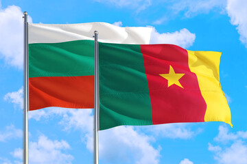 Cameroon and Bulgaria national flag waving in the windy deep blue sky. Diplomacy and international relations concept.